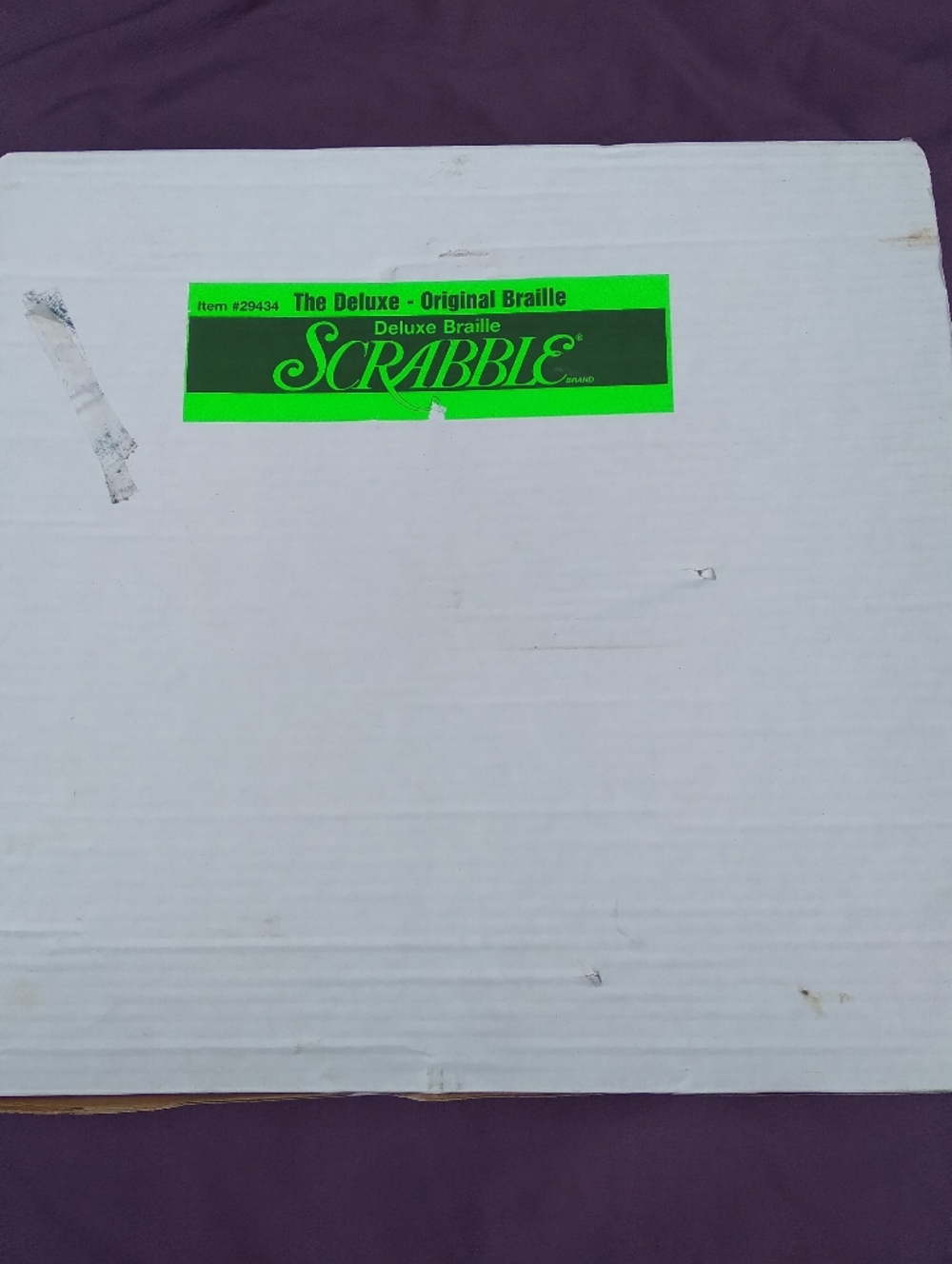 Scrabble Deluxe Braille Game Box in White with Neon Green Label
